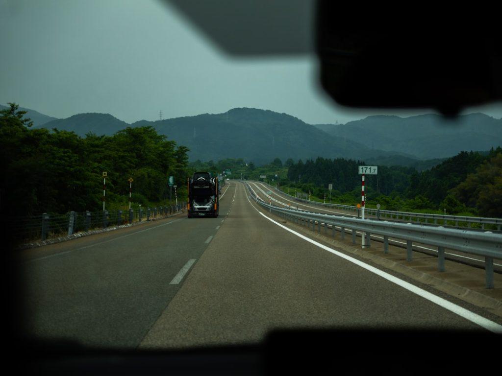 Car transportation cost from Bangalore to Delhi - carrier truck on highway