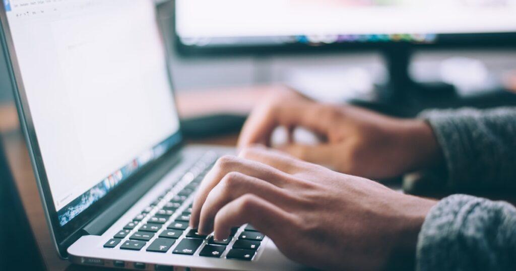 Website development cost for startups in India planning on a laptop